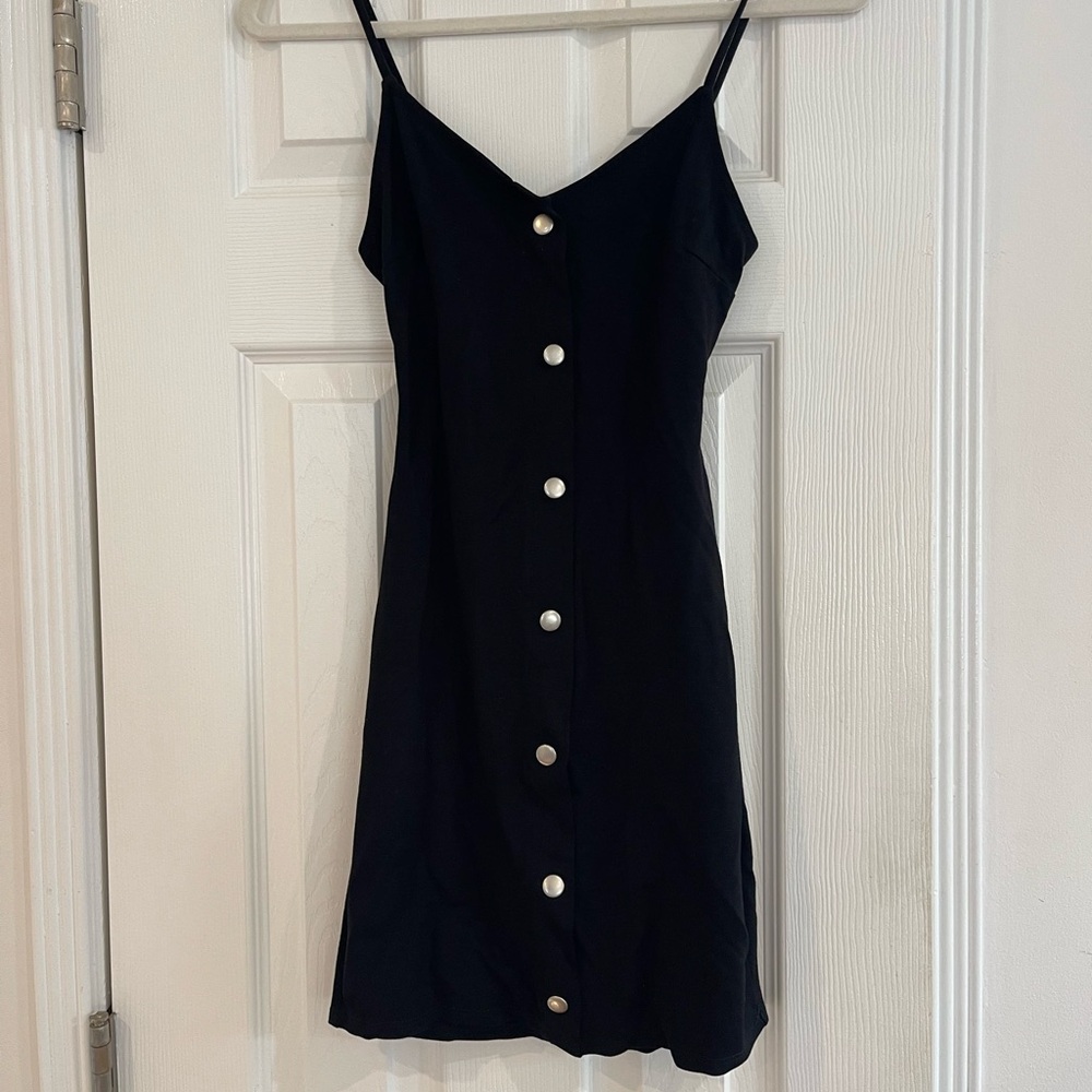 Black fitted mini dress with back cutout